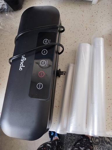 Photo of Vacuum sealer with rolls of plastic - 1