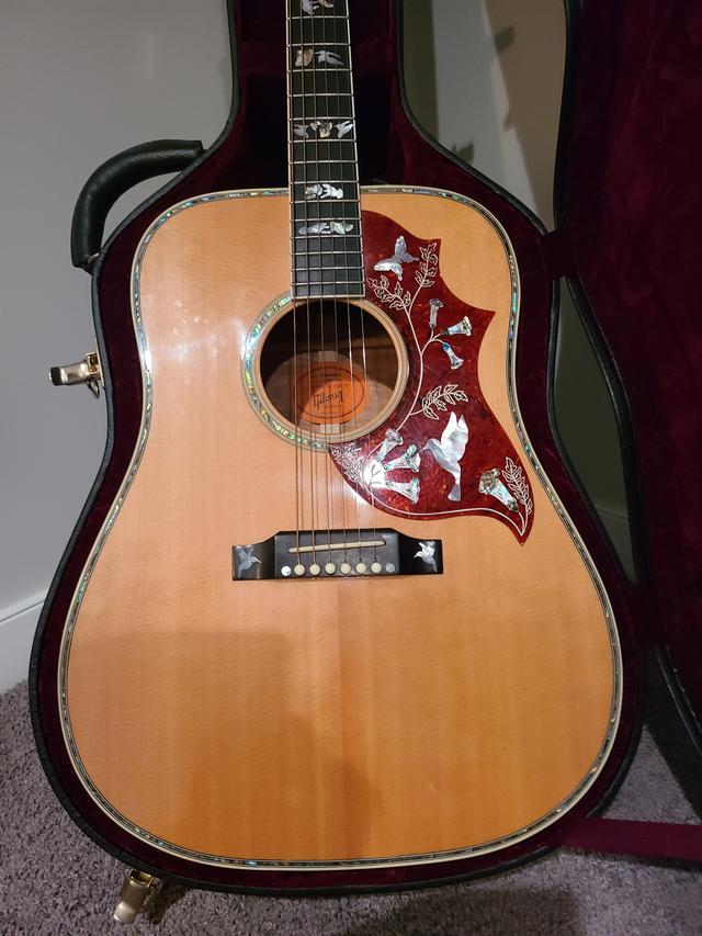 Photo of Gibson hummingbird Koa custom acoustic electric guitar. Like new condition. Willing to look at reasonable trades.