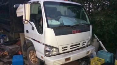 Photo of Vintage 2006 dump truck. ISUZU NPR - 1