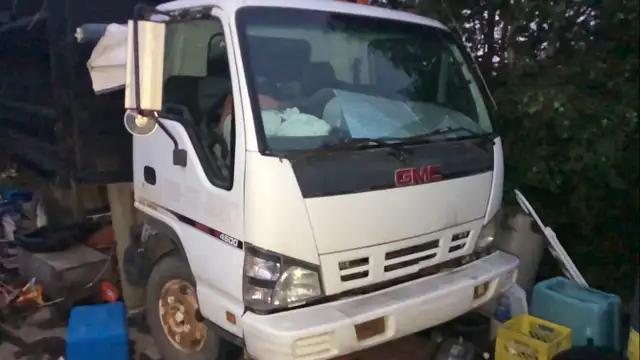 Photo of Vintage 2006 dump truck. ISUZU NPR