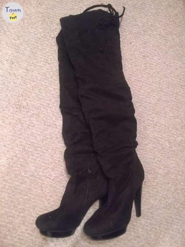 Photo of Black thigh high boots