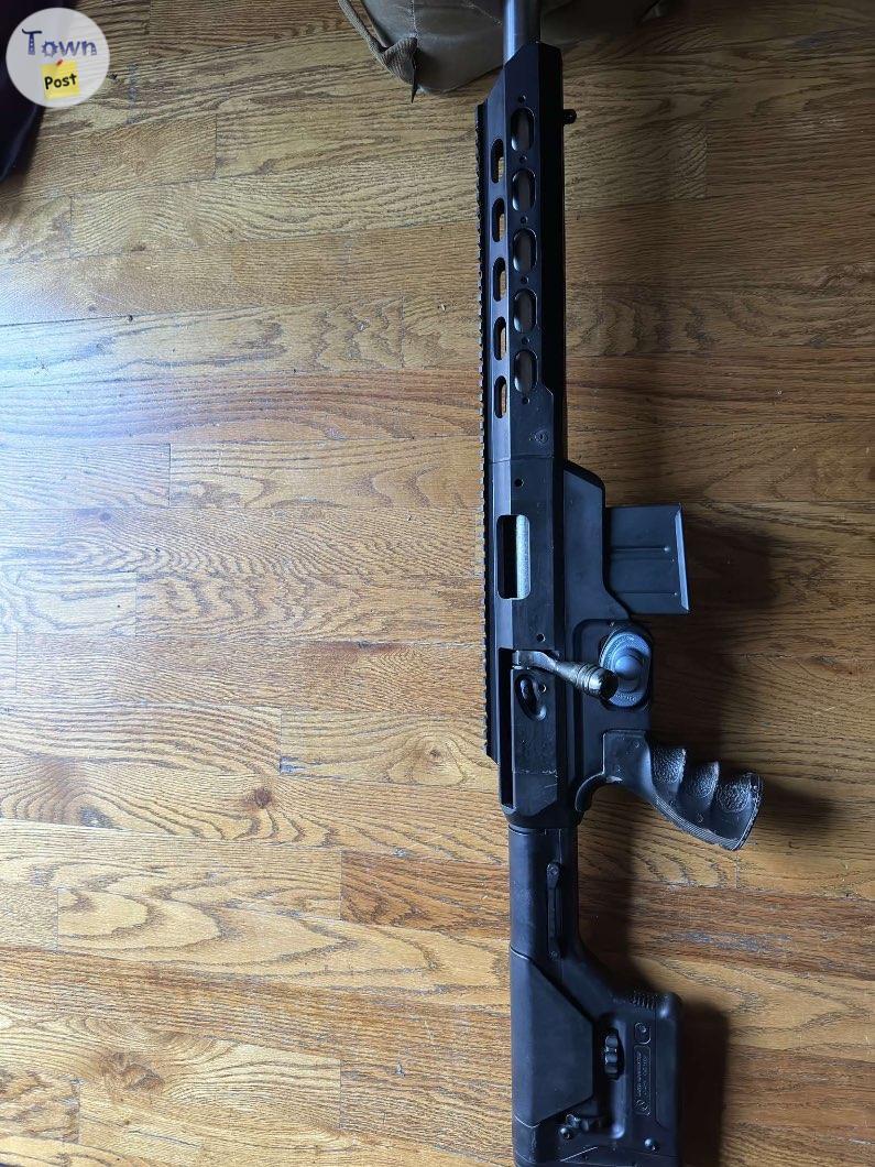 Photo of REM 700 in mdt tac 21 chassis and IBI 308 barrel