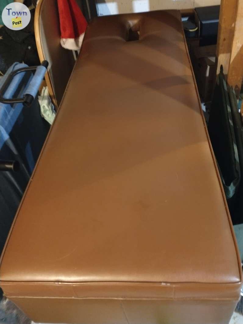 Photo of Massage table with Leather covering. Solid table. 