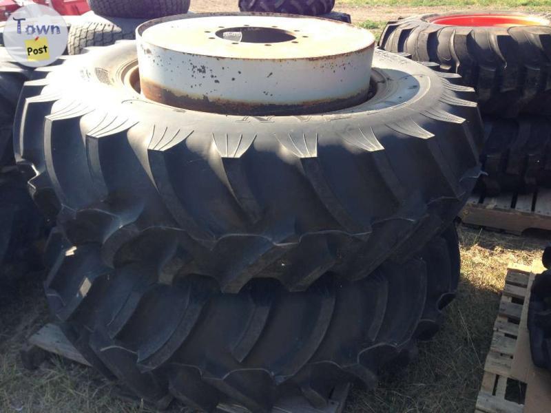 Photo of Michelin Titan 16.9x34 Tires R-1 on rims (2 count)