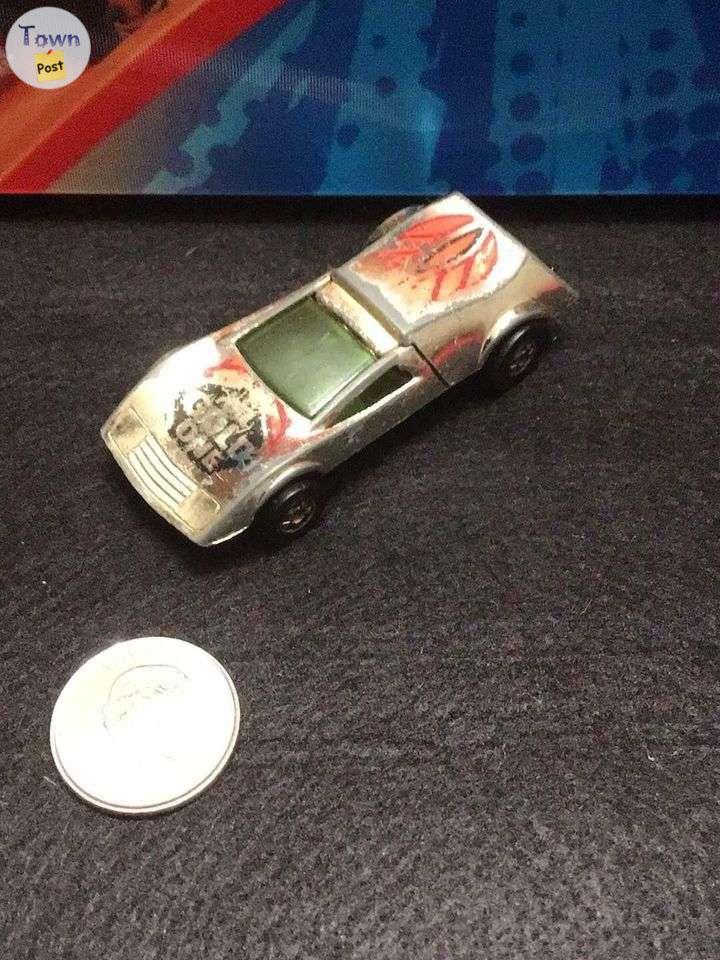 Photo of Hot Wheels 1969 Buzz Off the Gold One car loose.