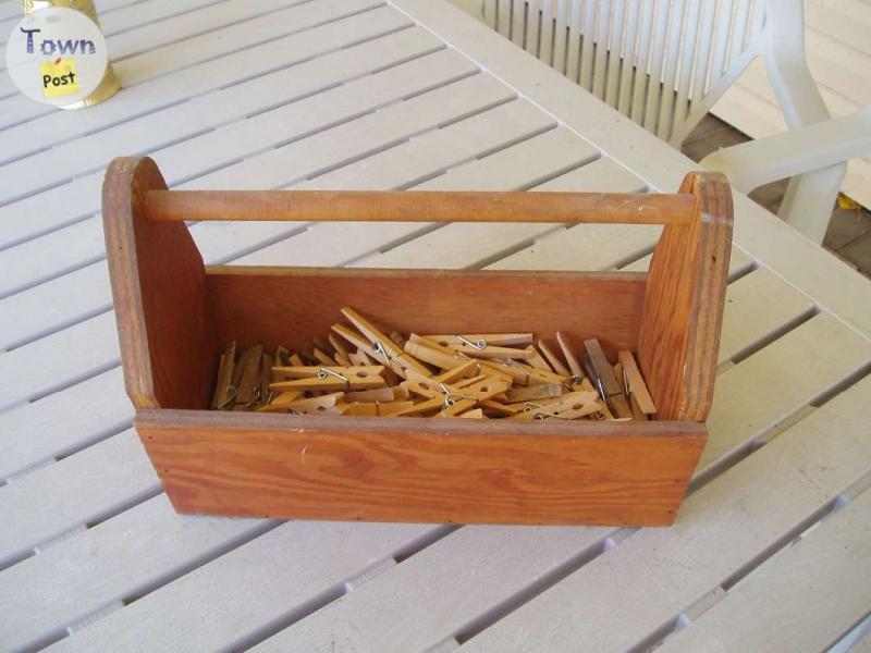 Photo of antique laundry box with wooden clothes pins 