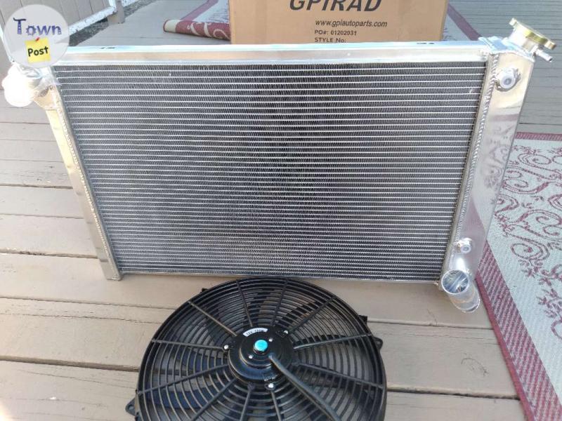 Photo of 1969 to 1972 three core aluminum radiator with fan Brand new never been installed original packaging 