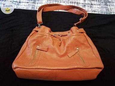 Photo of Large rust leather purse - 1