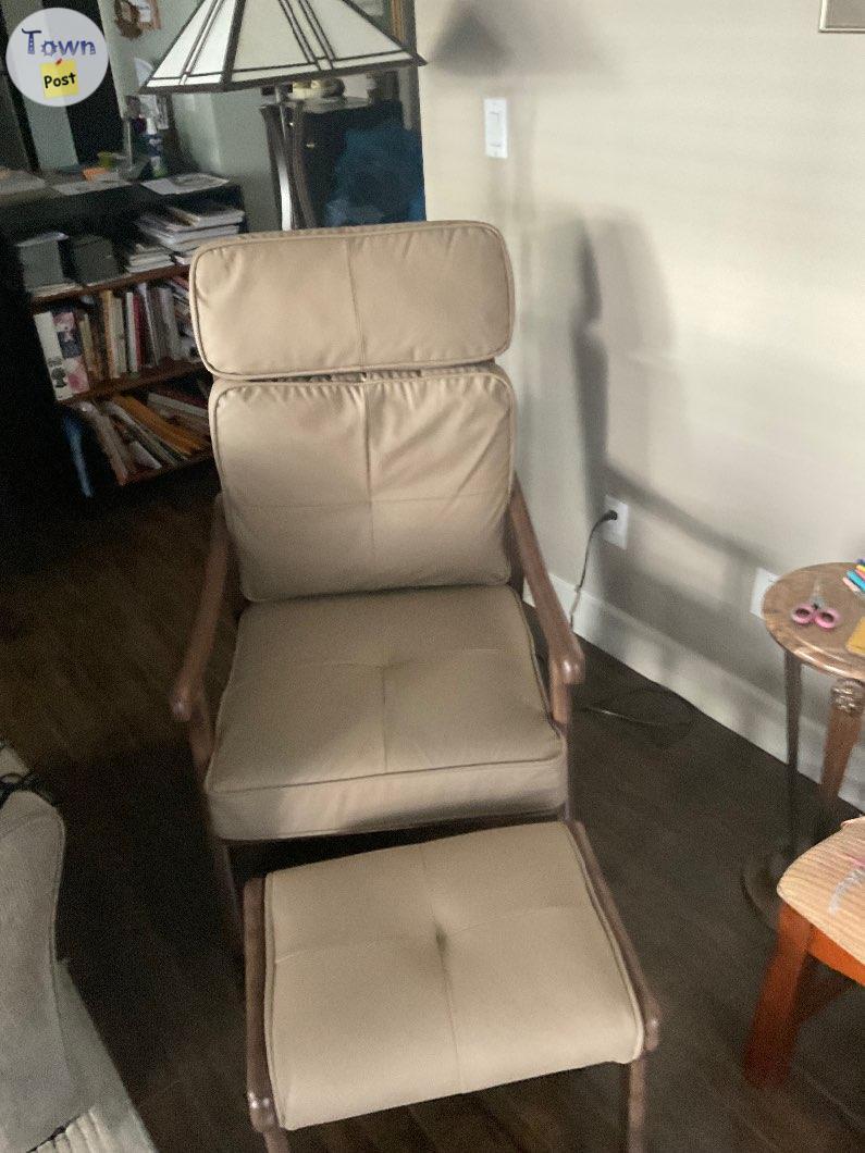 Photo of Wood frame faux leather chair and matching foot stool