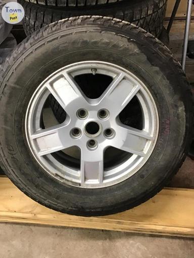 Photo of 245/65/17  4 blizack winter tires 1 Goodyear winter tire from jeep grand Cherokee - 2