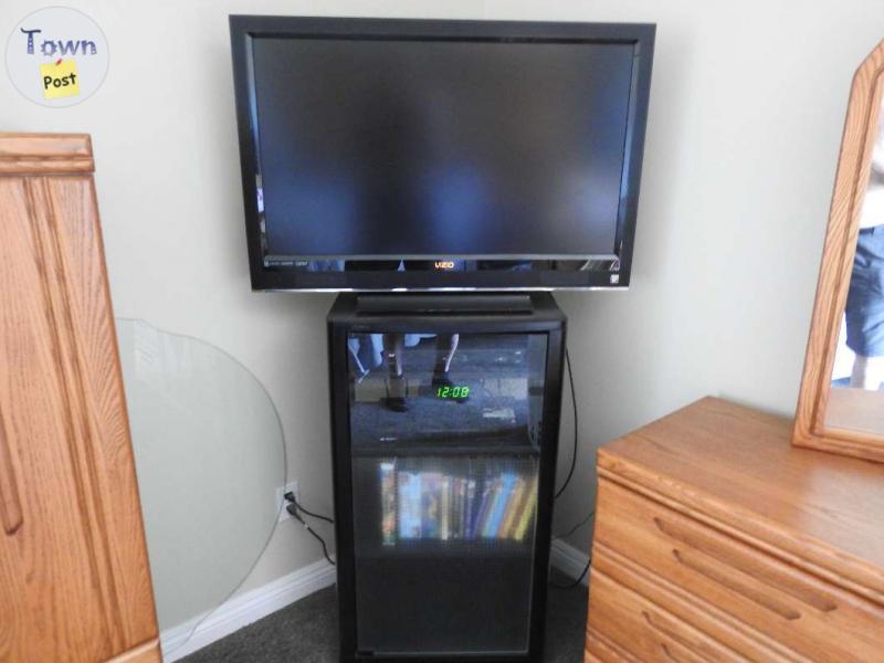 Photo of Vizio HD HDMI TV and Sony stand