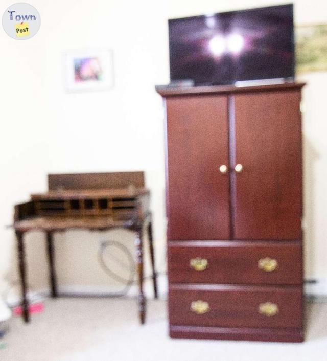 Photo of TV Armoire and Antique Desk