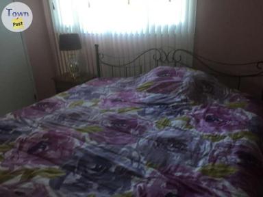 Photo of King size bed with metal frame and mattress - 1